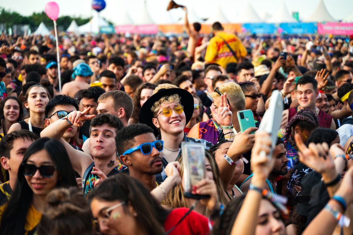 Crowd enjoying an outdoor music festival.