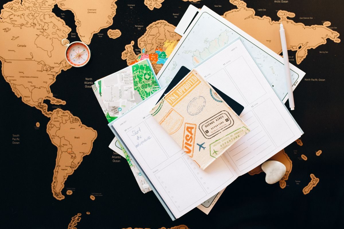 Travel notebook, map and planning equipment.